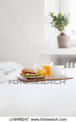 Tray of breakfast food on bed View Large Photo Image Stock Photo - Tray of breakfast food on bed. Fotosearch