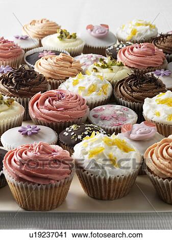 Stock Image - Tray of decorative cupcakes. Fotosearch