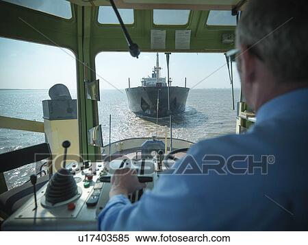 Tugboat pulling ship in ocean View Large Photo Image Stock Photography - Tugboat pulling ship in ocean. Fotosearch
