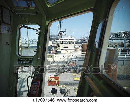 Tugboats in urban harbor View Large Photo Image Stock Photograph - Tugboats in urban harbor. Fotosearch