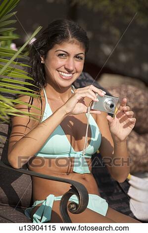 Woman taking pictures outdoors View Large Photo Image Stock Photography - Woman taking pictures outdoors. Fotosearch