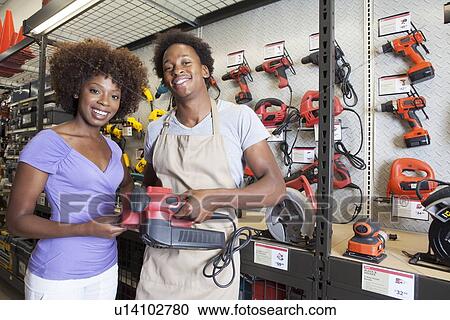 African American woman buying tool at hardware store View Large Photo Image Stock Image - African American woman buying tool at hardware store. Fotosearch