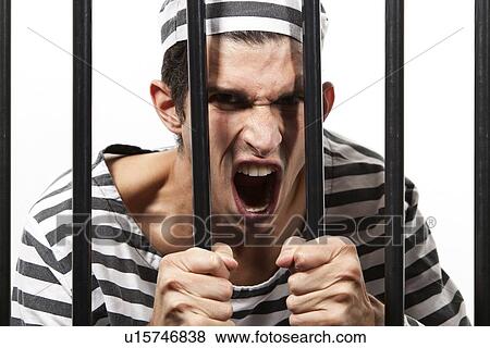 Convict yells through prison bars View Large Photo Image Stock Photo - Convict yells through prison bars. Fotosearch