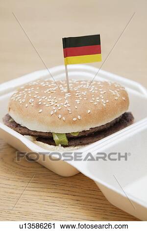 Fresh hamburger with German flag decoration on wooden surface View Large Photo Image Stock Image - Fresh hamburger with German flag decoration on wooden surface. Fotosearch