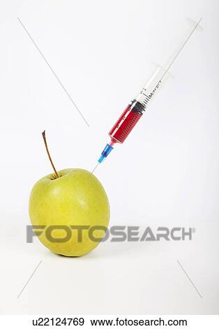 Granny smith apple being injected over white background View Large Photo Image Stock Photo - Granny smith apple being injected over white background. Fotosearch