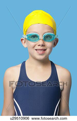 portrait of a happy young girl wearing swim goggles over blue background View Large Photo Image Stock Photograph - portrait of a happy young girl wearing swim goggles over blue background. Fotosearch