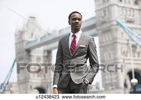 Stock Image - Portrait of African American businessman in London. Fotosearch