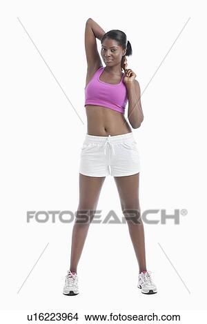 Picture - Portrait of young woman stretching arms over white background. Fotosearch
