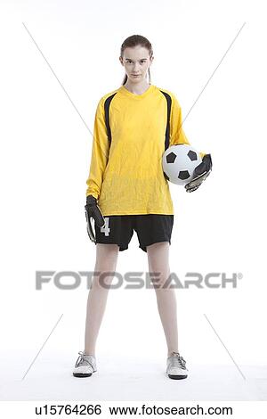 Portrait of young woman with soccer ball against white background View Large Photo Image Stock Photograph - Portrait of young woman with soccer ball against white background. Fotosearch