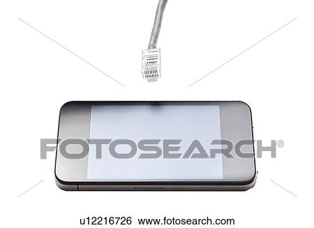 Stock Photograph - Smart phone with data cable plug against white background. Fotosearch