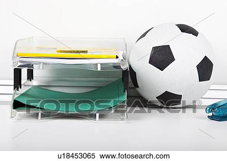 Soccer Ball Near File Rack At Desk Stock Photography U18453065