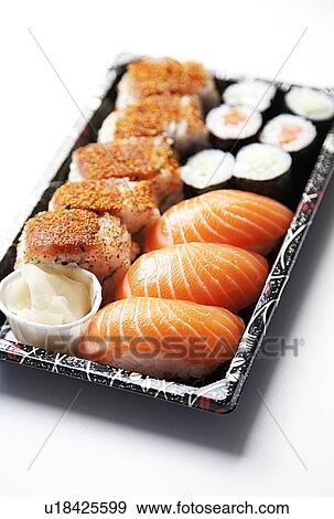 Sushi food on tray against white background View Large Photo Image Stock Photo - Sushi food on tray against white background. Fotosearch