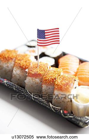 Stock Photography - Sushi food on tray with American flag against white background. Fotosearch