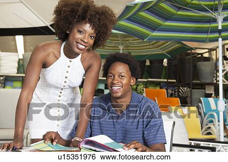 Young African American couple buying Outdoor furniture at Store View Large Photo Image Stock Photograph - Young African American couple buying Outdoor furniture at Store. Fotosearch