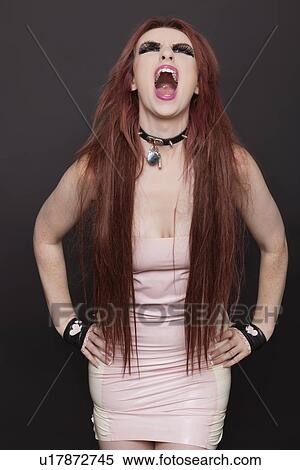 Young funky woman screaming against black background View Large Photo Image Stock Photography - Young funky woman screaming against black background. Fotosearch