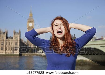 Angry young woman with hands on head screaming against Big Ben clock tower, London, UK View Large Photo Image Stock Photo - Angry young woman with hands on head screaming against Big Ben clock tower, London, UK. Fotosearch