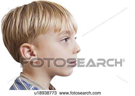Close-up of young boy looking at copy space over white background View Large Photo Image Stock Image - Close-up of young boy looking at copy space over white background. Fotosearch