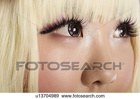 Extreme close-up of cute young woman's face with blond hair View Large Photo Image Stock Photo - Extreme close-up of cute young woman's face with blond hair. Fotosearch