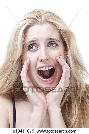 Stock Photo - Frustrated young woman screaming against white background. Fotosearch