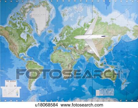 Model airplane flying over world map View Large Photo Image Picture - Model airplane flying over world map. Fotosearch