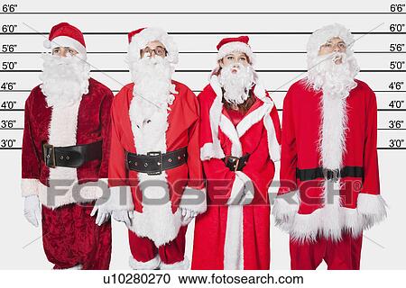 Stock Image - People in Santa costume standing side by side against police lineup. Fotosearch