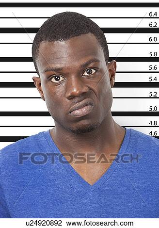 Portrait of angry young African American man against height chart View Large Photo Image Stock Image - Portrait of angry young African American man against height chart. Fotosearch