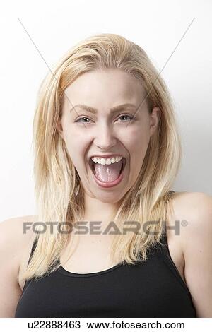 Portrait of cheerful young Caucasian woman against white background View Large Photo Image Stock Image - Portrait of cheerful young Caucasian woman against white background. Fotosearch
