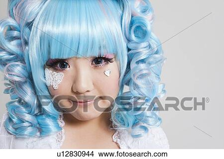 Portrait of cute young woman in doll costume over gray background View Large Photo Image Picture - Portrait of cute young woman in doll costume over gray background. Fotosearch