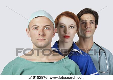 Portrait of three confident medical practitioners against gray background View Large Photo Image Stock Photograph - Portrait of three confident medical practitioners against gray background. Fotosearch