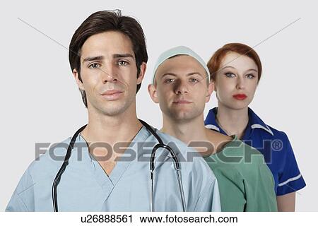 Portrait of three medical practitioners against gray background View Large Photo Image Stock Image - Portrait of three medical practitioners against gray background. Fotosearch