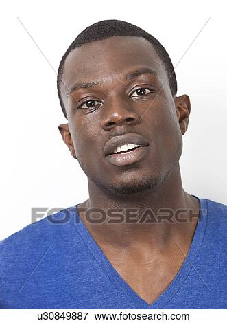 Portrait of young African American man against white background View Large Photo Image Stock Photo - Portrait of young African American man against white background. Fotosearch