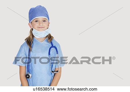 Portrait of young girl in surgeon's costume against gray background View Large Photo Image Picture - Portrait of young girl in surgeon's costume against gray background. Fotosearch
