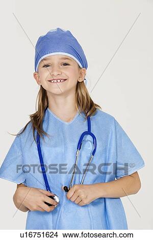 Portrait of young girl in surgeon's costume against gray background View Large Photo Image Picture - Portrait of young girl in surgeon's costume against gray background. Fotosearch