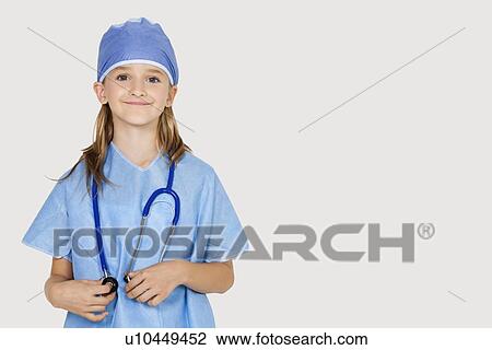 Portrait of young girl in surgeon's costume against gray background View Large Photo Image Stock Image - Portrait of young girl in surgeon's costume against gray background. Fotosearch