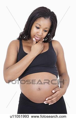 Young pregnant woman think with hand on chin over white background View Large Photo Image Stock Image - Young pregnant woman think with hand on chin over white background. Fotosearch