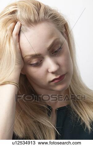 Young woman suffering from headache against white background View Large Photo Image Stock Image - Young woman suffering from headache against white background. Fotosearch