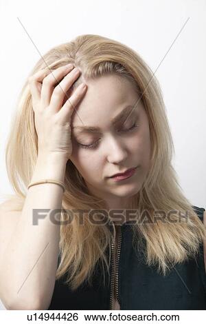 Young woman suffering from headache against white background View Large Photo Image Stock Photograph - Young woman suffering from headache against white background. Fotosearch
