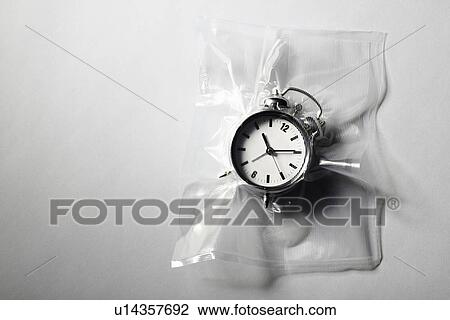 Alarm clock shrink wrapped in plastic View Large Photo Image Stock Image - Alarm clock shrink wrapped in plastic. Fotosearch
