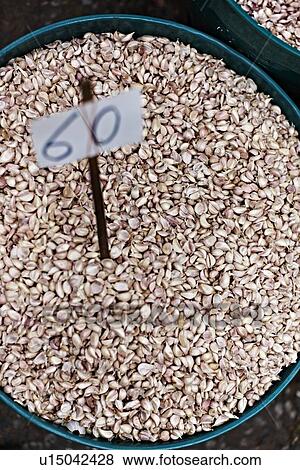 Stock Photo - Bin of garlic cloves at market. Fotosearch