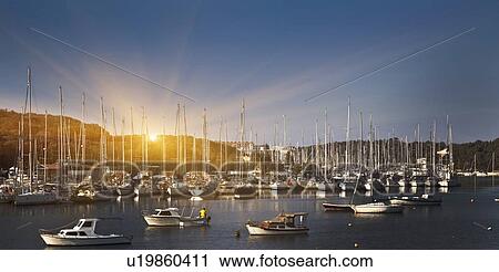 Boats docked in rural harbor View Large Photo Image Stock Image - Boats docked in rural harbor. Fotosearch