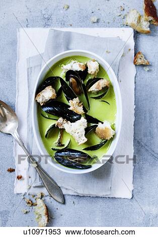 Bowl of pea and mussels soup View Large Photo Image Stock Image - Bowl of pea and mussels soup. Fotosearch