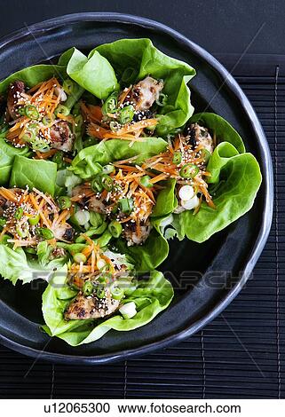 Bowl of salad wraps with lettuce View Large Photo Image Stock Image - Bowl of salad wraps with lettuce. Fotosearch