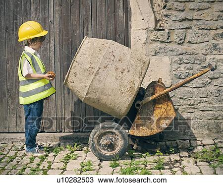 Stock Image - Boy playing construction with mixer. Fotosearch