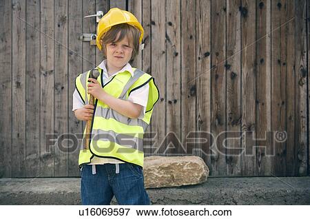 Stock Photo - Boy playing construction worker. Fotosearch