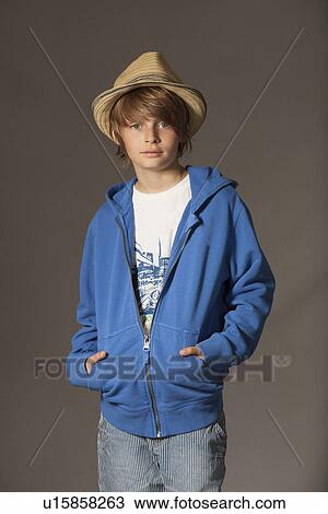 Boy smiling in studio View Large Photo Image Stock Image - Boy smiling in studio. Fotosearch