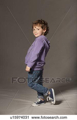 Boy smiling in studio View Large Photo Image Stock Image - Boy smiling in studio. Fotosearch