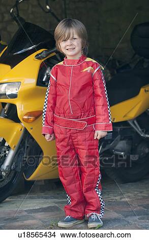 Picture - Boy wearing race car driver costume. Fotosearch