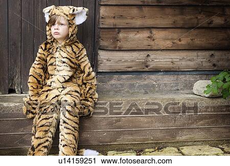 Boy wearing tiger costume outdoors View Large Photo Image Stock Image - Boy wearing tiger costume outdoors. Fotosearch