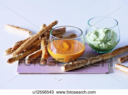 Stock Image - Breadsticks with dipping sauce. Fotosearch