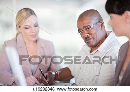 Business people talking in meeting View Large Photo Image Stock Photo - Business people talking in meeting. Fotosearch